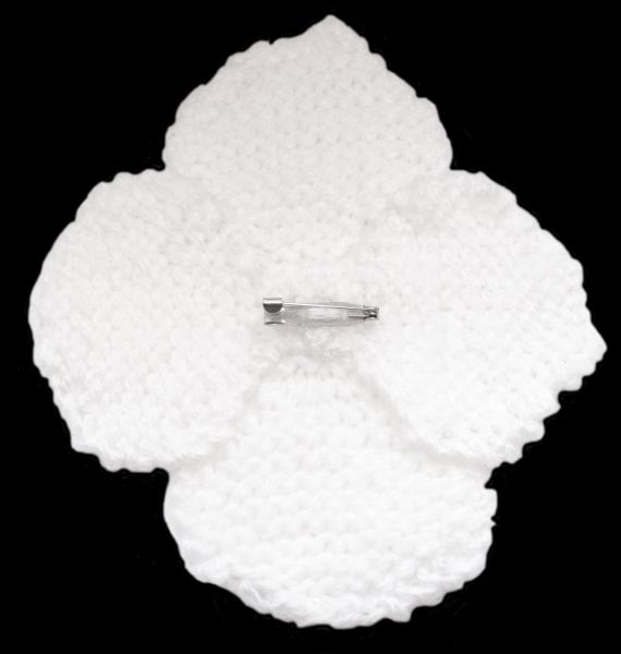 Hand knitted brooch in white with red pearl